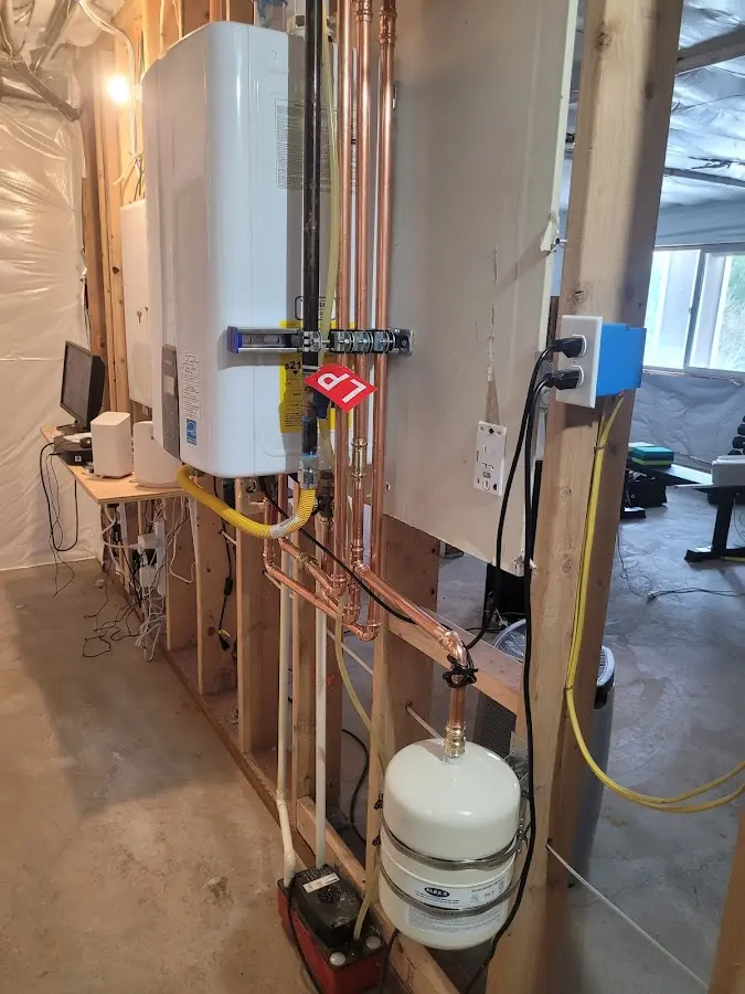 Licensed plumber repairing a kitchen sink in Forsyth