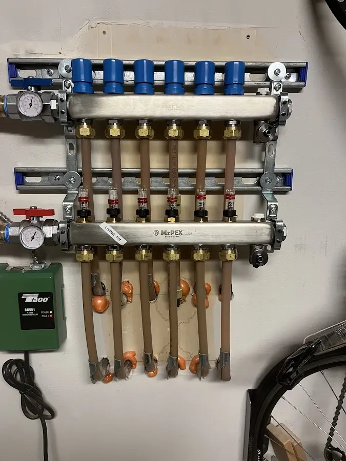 Plumber performing Gas Line Installation at a residential property in Forsyth