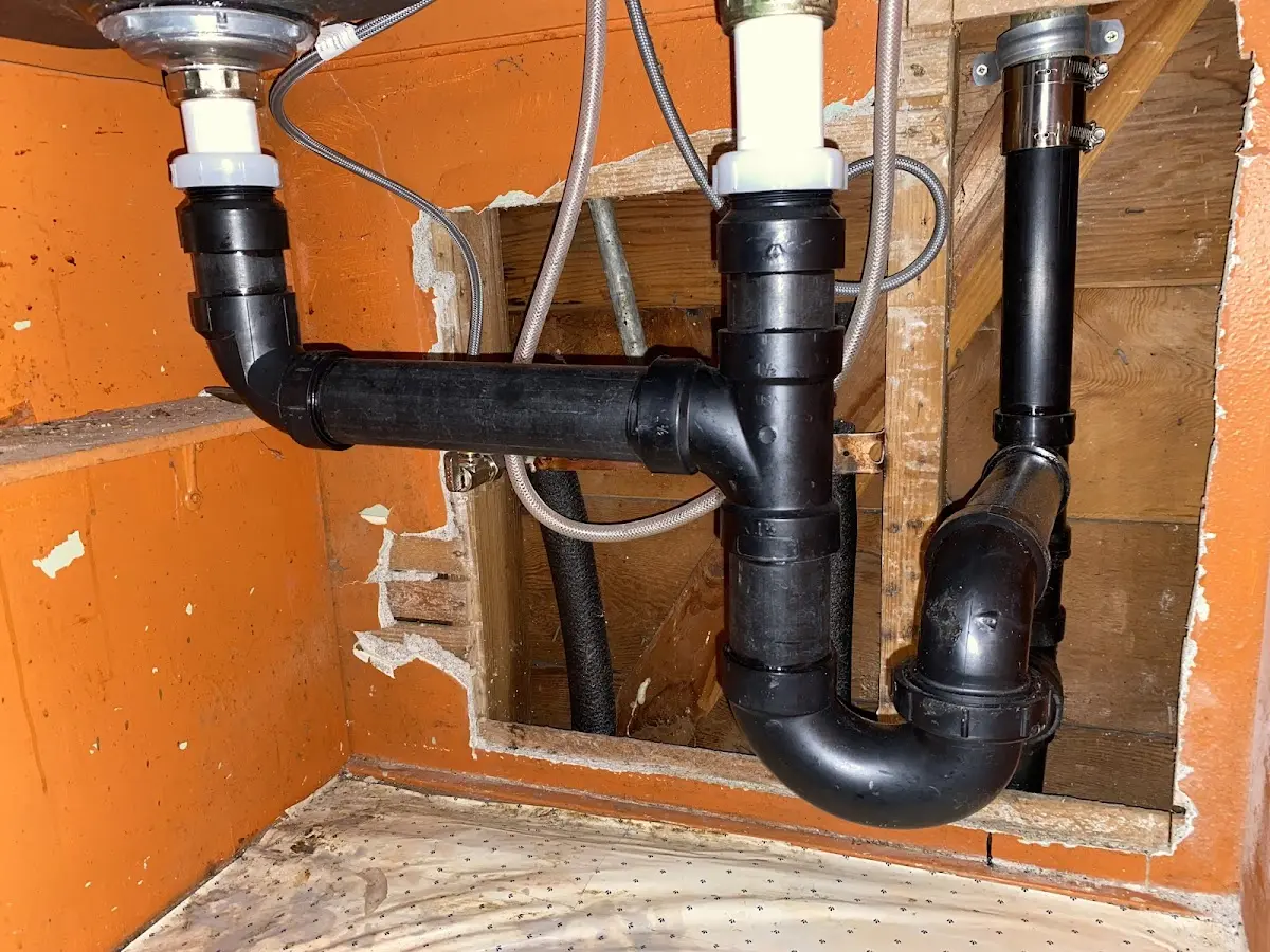 Professional Garbage Disposal Repair equipment and tools on the job in Forsyth